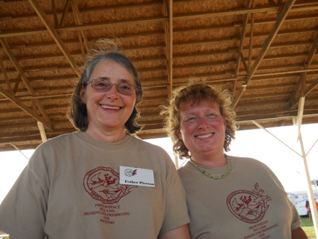 Two members of the Genealogical Society's ice cream making team model their society t-shirts.